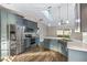 Open kitchen featuring a large island, stainless appliances, and modern finishes and flooring at 711 Hiview Cir, Port Orange, FL 32127
