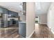 Modern kitchen with stainless steel appliances, sleek cabinets, and hardwood floors throughout at 711 Hiview Cir, Port Orange, FL 32127