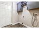 A simple laundry room with storage cabinets and essential hookups at 711 Hiview Cir, Port Orange, FL 32127