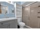 Bathroom with shower stall, mirrored vanity, and built in shelving for ample storage space at 898 Glasgow Ave, Deltona, FL 32738