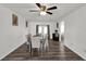 Bright dining room boasting hardwood floors, a modern ceiling fan, and a seamless transition to the backyard at 898 Glasgow Ave, Deltona, FL 32738