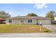 Charming single-story home featuring a well-maintained front yard, a driveway and an attached two-car garage at 898 Glasgow Ave, Deltona, FL 32738