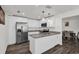 Modern kitchen featuring stainless steel appliances, custom cabinetry, and granite countertops at 898 Glasgow Ave, Deltona, FL 32738