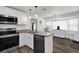 Beautiful kitchen featuring sleek appliances, granite countertops and warm pendant lighting at 898 Glasgow Ave, Deltona, FL 32738