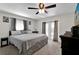Serene main bedroom with a soft color palette, backyard access, and stylish ceiling fan at 898 Glasgow Ave, Deltona, FL 32738