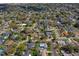 Aerial view of the residential neighborhood featuring mature trees, well-maintained lawns, and nearby streets at 901 Ponca Trl, Maitland, FL 32751