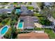 Aerial view of the home showing the backyard pool, driveway, and well-kept lawn at 901 Ponca Trl, Maitland, FL 32751