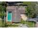 Aerial view of the home highlighting the pool, driveway, and well-maintained landscaping at 901 Ponca Trl, Maitland, FL 32751