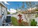 Backyard featuring a white fence, lush greenery, a well-maintained lawn, and an HVAC system at 901 Ponca Trl, Maitland, FL 32751