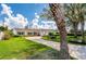 Charming single-story home featuring a well-manicured lawn, mature trees, and a curved driveway at 901 Ponca Trl, Maitland, FL 32751