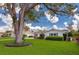 Charming home with a well-manicured front yard, mature trees, and inviting curb appeal at 901 Ponca Trl, Maitland, FL 32751