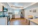 Well-lit kitchen featuring stainless steel appliances, white cabinetry, and a cozy breakfast nook at 901 Ponca Trl, Maitland, FL 32751