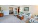 Inviting living room with plush seating, a decorative coffee table, and views of the dining area at 901 Ponca Trl, Maitland, FL 32751
