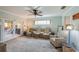 Comfortable living room with reclining sofa, armchair, and natural light at 901 Ponca Trl, Maitland, FL 32751