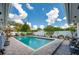 Private backyard pool with brick paving, surrounded by mature trees and a white fence at 901 Ponca Trl, Maitland, FL 32751