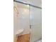 Bathroom features a shower with tiled walls, a sliding door, and a convenient corner seat at 901 Ponca Trl, Maitland, FL 32751