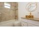 Bright bathroom with tub, vessel sink, and updated granite countertops at 926 Sycamore St, Daytona Beach, FL 32114