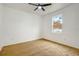 Bright bedroom features a ceiling fan and natural light from the window at 926 Sycamore St, Daytona Beach, FL 32114