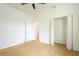 Bedroom featuring neutral carpeting, a ceiling fan, and spacious closet at 926 Sycamore St, Daytona Beach, FL 32114