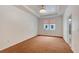 Spacious bedroom with tray ceiling, neutral carpet, and bright natural light at 926 Sycamore St, Daytona Beach, FL 32114