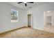 Bedroom with neutral carpet, closet, and a doorway to the hallway at 926 Sycamore St, Daytona Beach, FL 32114