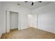 This bedroom boasts neutral carpeting and a spacious closet for ample storage at 926 Sycamore St, Daytona Beach, FL 32114