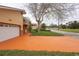 Single Gathering home featuring a two-car garage and charming front porch with decorative columns at 926 Sycamore St, Daytona Beach, FL 32114