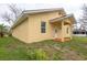 Exterior view of the home, showcasing the siding, windows, and well-maintained lawn at 926 Sycamore St, Daytona Beach, FL 32114
