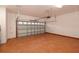 Spacious garage with light-colored walls and a door with translucent panels, offering ample parking and storage at 926 Sycamore St, Daytona Beach, FL 32114