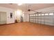 Well-lit garage featuring an automatic door, water heater, and a painted floor, perfect for storage or workshop space at 926 Sycamore St, Daytona Beach, FL 32114