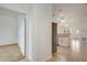 Hallway view leading to the kitchen, showcasing tile flooring and neutral walls at 926 Sycamore St, Daytona Beach, FL 32114