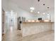 Modern kitchen and dining area with stainless appliances, sleek white cabinetry, and a tiled breakfast bar at 926 Sycamore St, Daytona Beach, FL 32114