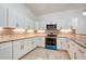 Bright kitchen with granite countertops, white cabinets, and stainless steel appliances at 926 Sycamore St, Daytona Beach, FL 32114