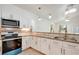 Updated kitchen with stainless steel appliances, granite countertops, and ample cabinet space at 926 Sycamore St, Daytona Beach, FL 32114