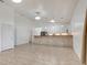 Spacious open-concept area with a breakfast bar, tile flooring, and ample natural light at 926 Sycamore St, Daytona Beach, FL 32114