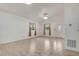 Inviting living space featuring tile flooring, bright windows, and a welcoming front entrance with a decorative door at 926 Sycamore St, Daytona Beach, FL 32114
