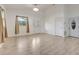 Bright living area with tile floors, large windows, and a front door with decorative glass, creating an airy atmosphere at 926 Sycamore St, Daytona Beach, FL 32114