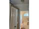 This bathroom has a garden tub, a half moon window, and light colored walls at 961 Oakwood Rd, Orange City, FL 32763