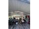 Open carport with lawn equipment, trailer, and ample storage space at 961 Oakwood Rd, Orange City, FL 32763