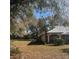 Well-maintained home featuring a durable roof, stone accents, and lush landscaping at 961 Oakwood Rd, Orange City, FL 32763