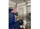 Garage with an American flag and blue Craftsman tool box at 961 Oakwood Rd, Orange City, FL 32763