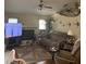 This living room has a ceiling fan, fireplace, comfortable couches, and neutral decor at 961 Oakwood Rd, Orange City, FL 32763