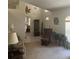 A cozy room features a comfy armchair, a china cabinet, and warm, inviting colors at 961 Oakwood Rd, Orange City, FL 32763