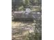 Exterior shot of a large propane tank in a wooded backyard at 961 Oakwood Rd, Orange City, FL 32763