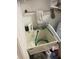 This utility sink area has ample storage, a towel rack, and cleaning supplies at 961 Oakwood Rd, Orange City, FL 32763