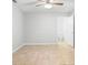 This bedroom features neutral walls, tile flooring, and ceiling fan at 1576 Naples Cir, Deltona, FL 32738