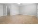 Neutral bedroom with tile flooring, a ceiling fan, walk-in closet, and a view to other rooms at 1576 Naples Cir, Deltona, FL 32738