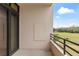 Balcony with view of green spaces and palm trees at 1 Oceans West Blvd # 1B2, Daytona Beach, FL 32118