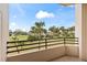Balcony overlooking green spaces and palm trees at 1 Oceans West Blvd # 1B2, Daytona Beach, FL 32118
