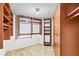 Walk-in closet with custom shelving and ample storage space at 1 Oceans West Blvd # 1B2, Daytona Beach, FL 32118